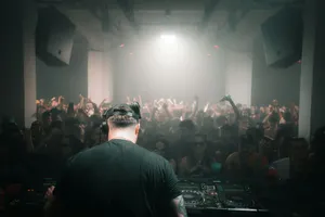 DJ performing for a crowd in a nightclub