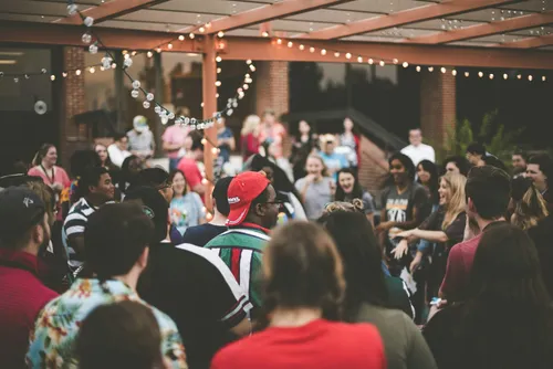 Guests laughing together at a lively party