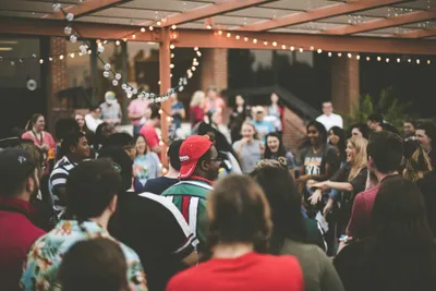Guests laughing together at a lively party
