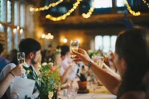 Guests raising wine glasses in a toast